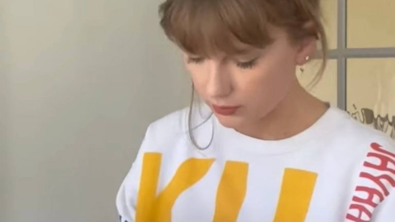 A glimpse of Taylor Swift's life with Travis Kelce is shared in a new video. And she's wearing KU gear