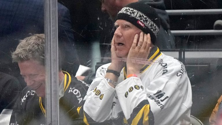 Actor Will Ferrell covers his ears as the crowd is asked to make noise during the first period in Game 4 of an NHL hockey Stanley Cup first-round playoff series between the Los Angeles Kings and the Edmonton Oilers Sunday, April 28, 2024, in Los Angeles.